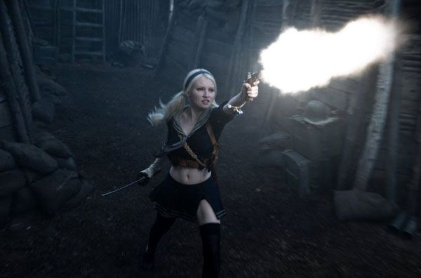 Baby Doll, played by Emily Browning, unleashes raw firepower in SUCKER PUNCH.