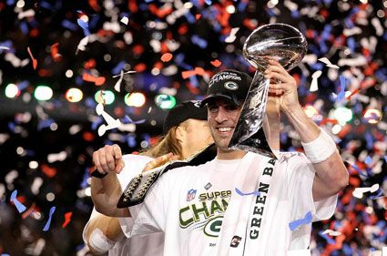 Packers quarterback Aaron Rodgers celebrates with the Lombardi Trophy after his team won 31-25 against the Pittsburgh Steelers in Super Bowl XLV, on February 6, 2011.