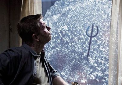 Lucifer kills time by drawing on a window in SUPERNATURAL.