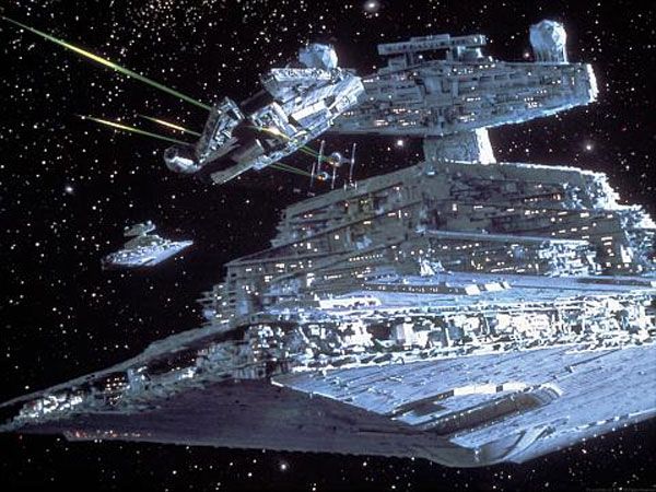 The Millennium Falcon tries to evade TIE Fighters and Star Destroyers in this promo pic from THE EMPIRE STRIKES BACK.