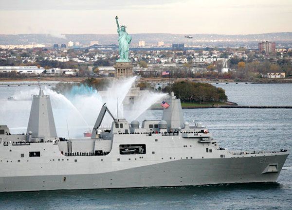 The USS NEW YORK passes by the Statue of Liberty after arriving at its namesake state on November 2, 2009.