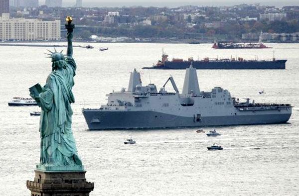 The USS NEW YORK approaches the Statue of Liberty after arriving at its namesake state on November 2, 2009.