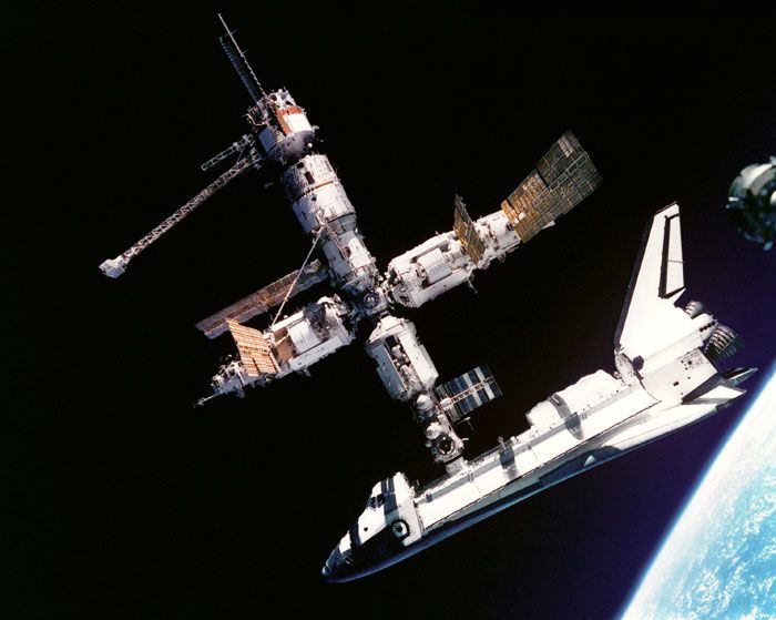 Space shuttle ATLANTIS is docked to the Russian space station MIR in 1995.