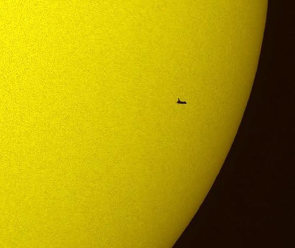 A day before docking with the HUBBLE SPACE TELESCOPE, space shuttle ATLANTIS is seen crossing the Sun on May 12, 2009.