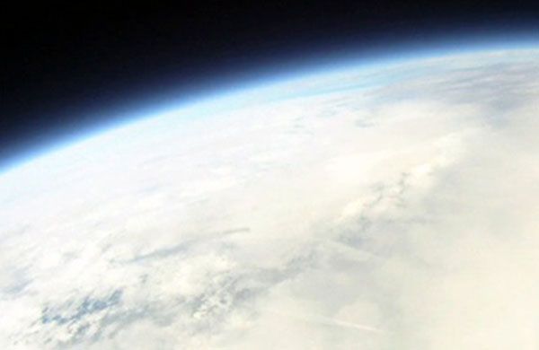 The curvature of the Earth...as seen by a video camera attached to a weather balloon flying 100,000 feet off the ground.