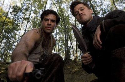 Aldo Raine and Donny Donowitz (Eli Roth) look at their gory handiwork in INGLOURIOUS BASTERDS.