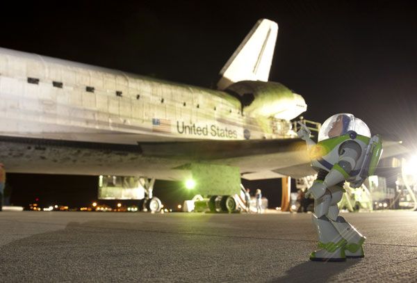 Buzz Lightyear gazes at the spacecraft that took him home on September 11, 2009.