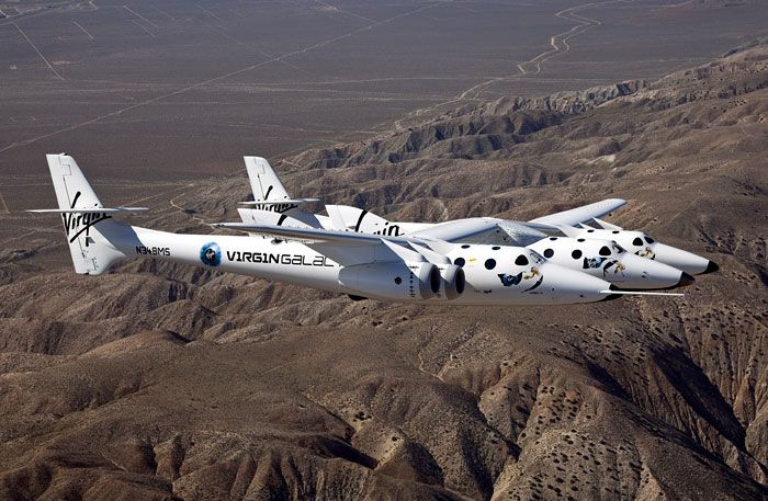 The VMS Eve and VSS Enterprise soar above California's Mojave Desert.