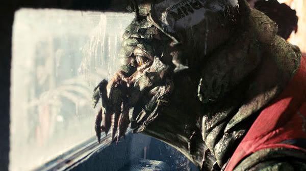 Christopher Johnson, a prawn held captive inside an MNU armored truck, gazes out the window to see what's going on in DISTRICT 9.