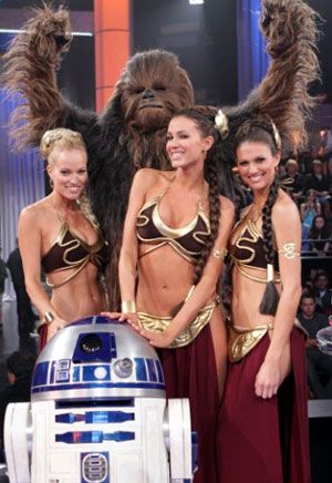 Chewbacca and R2D2 pose with sexy Slave Girl Leias on the set of DEAL OR NO DEAL.