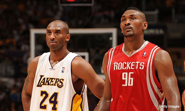 Kobe Bryant and Ron Artest stand side-by-side during a Lakers-Houston Rockets game.