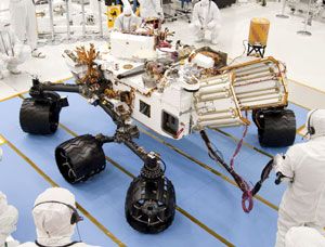 Engineers work on the CURIOSITY Mars Rover at NASA's Jet Propulsion Laboratory in Pasadena, California.