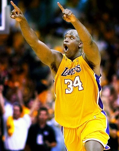 Shaquille O'Neal celebrates after the Lakers advance to the 2000 NBA Finals after beating the Portland Trailblazers in 7 games during the Western Conference Finals that year.