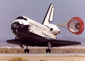 A space shuttle lands at Edwards Air Force Base in California.