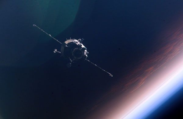 A manned Russian Soyuz spacecraft, as seen by a crewmember onboard the International Space Station.
