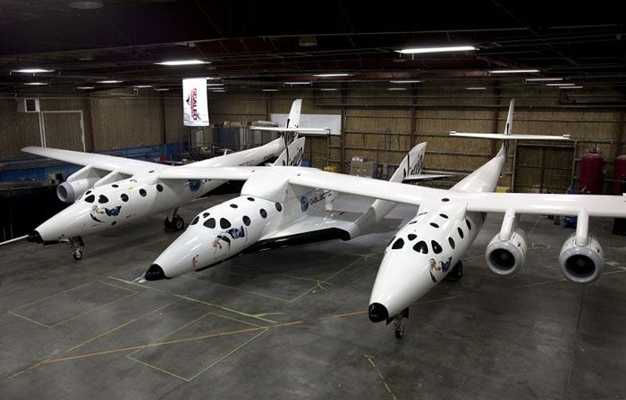 SpaceShipTwo as seen with White Knight II inside a hangar.