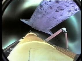 A camera onboard Discovery's external fuel tank captures this footage of the orbiter separating after main engine cut-off following launch.