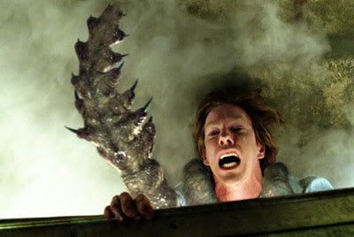 Norm (Chris Owen) is dragged out into The Mist by an unseen tentacled creature.