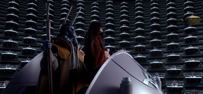 Darth Sidious, dressed in his Chancellor robe, addresses the Galactic Senate.