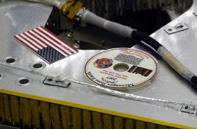 The Phoenix DVD, which bears the names of 250,000 people, after it is attached to the deck of the lander.