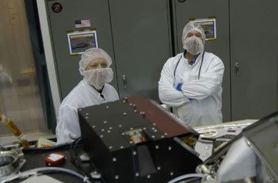 Two Lockheed Martin technicians pose with the Phoenix DVD...which can be seen below the engineer to the right of the photo.