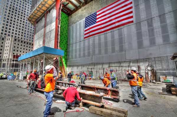 Workers sign the steel column that made the 1 World Trade Center (1 WTC) the tallest building in New York City (NYC), on April 30, 2012.