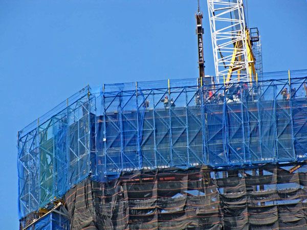 The steel column that made the 1 WTC the tallest building in NYC is secured to the skyscraper's framework, on April 30, 2012.