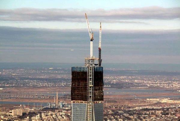 Cranes that will assemble the 1 World Trade Center's (1 WTC) antenna spire are set up on the roof of the skyscraper, on January 11, 2013.