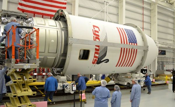 Orbital Sciences' Cygnus freighter is about to be encapsulated inside the Antares rocket's payload fairing at NASA's Wallops Flight Facility in Virginia, on September 9, 2013. Orbital Sciences' Cygnus freighter is about to be encapsulated inside the Antares rocket's payload fairing at NASA's Wallops Flight Facility in Virginia, on September 9, 2013.