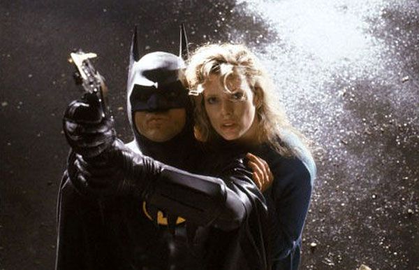 Michael Keaton (as the Dark Knight) and Kim Basinger (as Vicki Vale) in Tim Burton’s 1989 hit film, BATMAN.