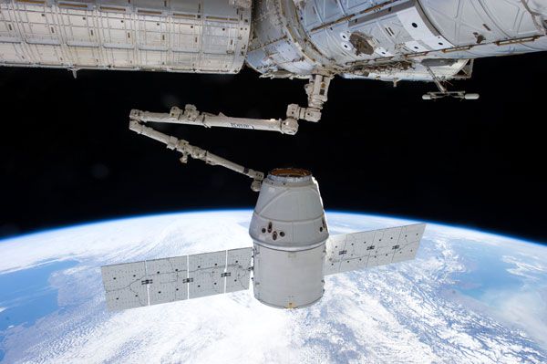 The ISS' robotic arm grapples the Dragon CRS-2 spacecraft prior to it berthing at the outpost on March 3, 2013. The ISS' robotic arm grapples the Dragon CRS-2 spacecraft prior to it berthing at the outpost on March 3, 2013.