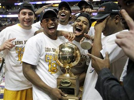 Players of CSULB's men's basketball team celebrate after defeating UC Santa Barbara, 77-64, in the Big West Conference title game on March 10, 2012.