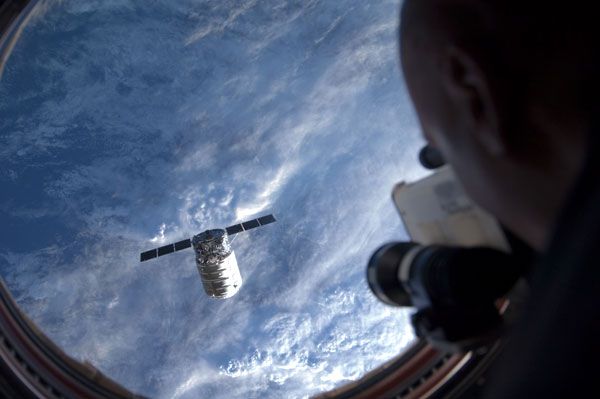 ISS crew member Luca Parmitano observes Cygnus Orb-D1 as it floats near the ISS prior to berthing on September 29, 2013. ISS crew member Luca Parmitano observes Cygnus Orb-D1 as it floats near the ISS prior to berthing on September 29, 2013.
