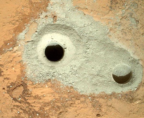 An image of the two holes made by the drill at the end of the Curiosity Mars rover's robotic arm, taken on February 8, 2013.