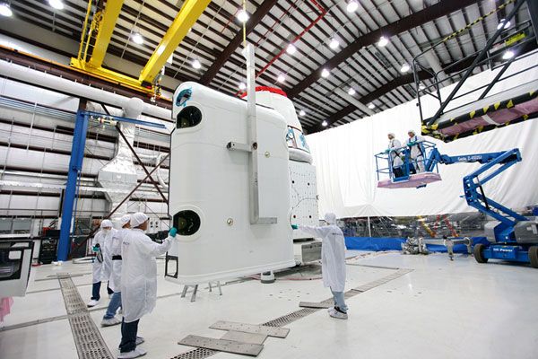 A solar array fairing is about to be attached to SpaceX's Dragon CRS-2 vehicle at Cape Canaveral Air Force Station in Florida...on January 12, 2013. A solar array fairing is about to be attached to SpaceX's Dragon CRS-2 vehicle at Cape Canaveral Air Force Station in Florida...on January 12, 2013.