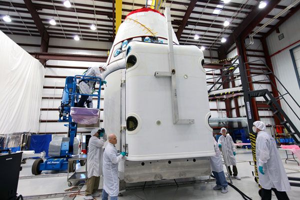 A solar array fairing is about to be attached to SpaceX's Dragon CRS-2 vehicle at Cape Canaveral Air Force Station in Florida...on January 14, 2013. A solar array fairing is about to be attached to SpaceX's Dragon CRS-2 vehicle at Cape Canaveral Air Force Station in Florida...on January 14, 2013.