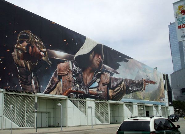 A large banner promoting the upcoming ASSASSIN'S CREED: BLACK FLAG.