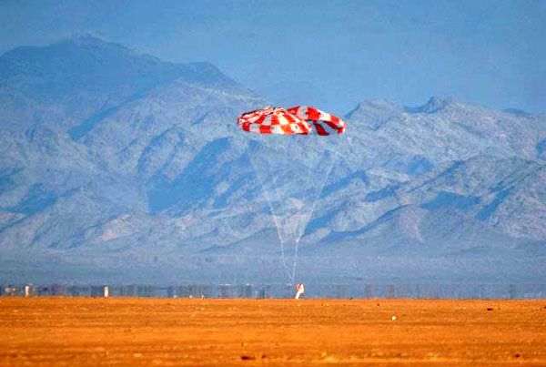The Orion test article touches down at the U.S. Army's Yuma Proving Grounds in Arizona after a successful drop test, on December 21, 2011.