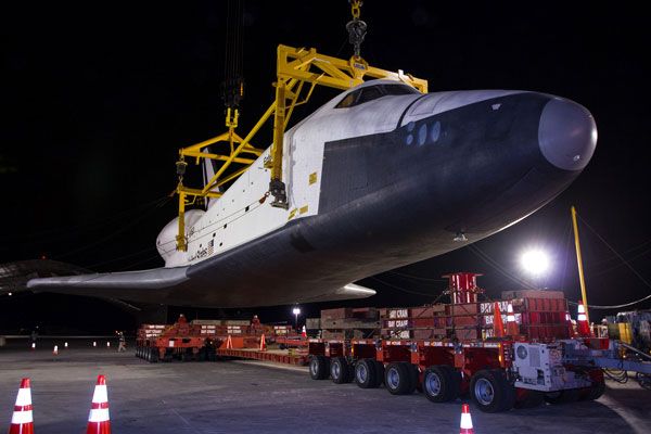 Enterprise is about to be lowered onto a transport vehicle after demating from NASA 905 at JFK International Airport, on May 12, 2012.