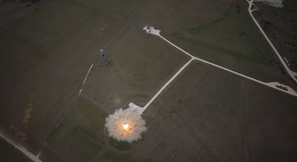 As the unmanned Hexacopter hovers above, the Grasshopper test vehicle lifts off from its pad in McGregor, Texas, to fly to an altitude of 744 meters (2,441 feet) on October 7, 2013. As the unmanned Hexacopter hovers above, the Grasshopper test vehicle lifts off from its pad in McGregor, Texas, to fly to an altitude of 744 meters (2,441 feet) on October 7, 2013.