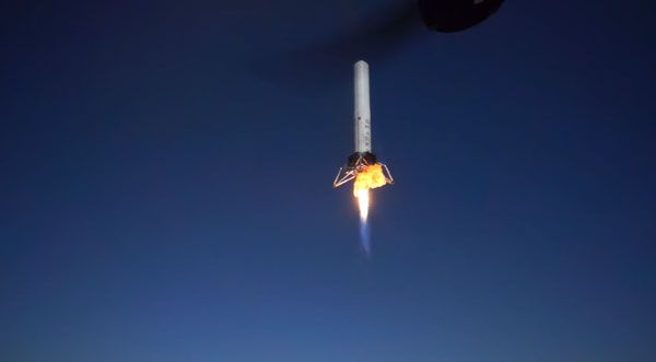 As the unmanned Hexacopter hovers nearby, the Grasshopper test vehicle soars toward an altitude of 744 meters (2,441 feet) above McGregor, Texas, on October 7, 2013. As the unmanned Hexacopter hovers nearby, the Grasshopper test vehicle soars toward an altitude of 744 meters (2,441 feet) above McGregor, Texas, on October 7, 2013.