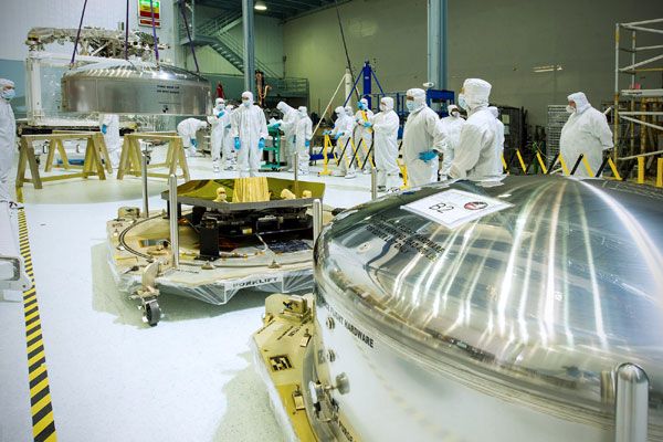 At the Goddard Space Flight Center in Maryland, one of the JWST's first two mirror segments to arrive is inspected while the other awaits opening in its shipping container.