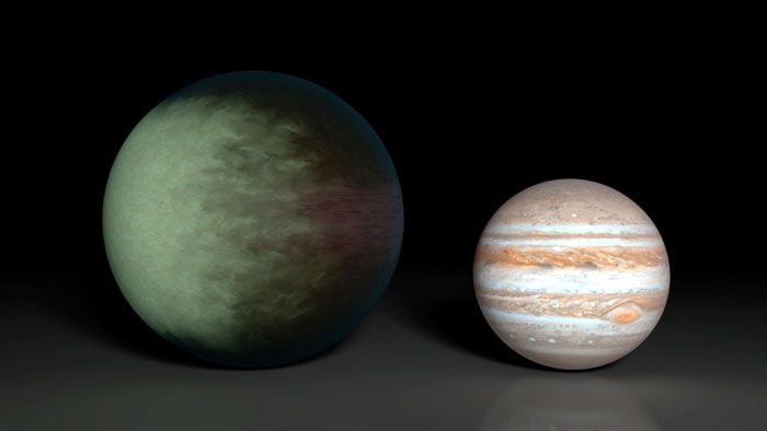 An artist's concept comparing the size of Kepler-7b to Jupiter.