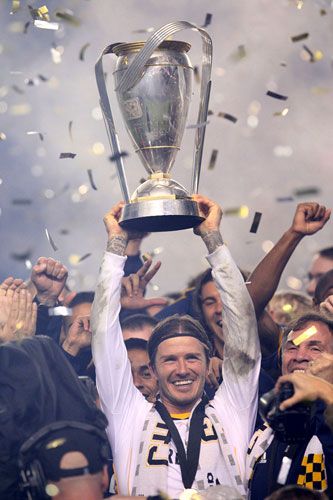 David Beckham holds up the Philip F. Anschutz Trophy after the Los Angeles Galaxy defeats the Houston Dynamo, 1-0, to win the 2011 MLS Cup...on November 20, 2011.