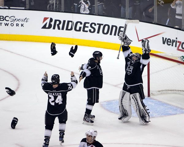 As the game clock hits zero, Los Angeles Kings players celebrate as the team wins its very first Stanley Cup championship on June 11, 2012.