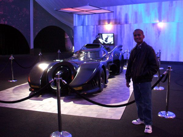 Posing with the Batmobile from Tim Burton's 1989 BATMAN film, on December 7, 2012.