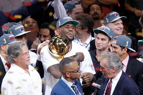 LeBron James holds the Larry O'Brien trophy after the Miami Super Friends—err, Heat—defeated the Oklahoma City Thunder to win the NBA championship...on June 21, 2012.