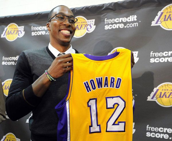 Dwight Howard presents the jersey that he's going to wear this upcoming NBA season.