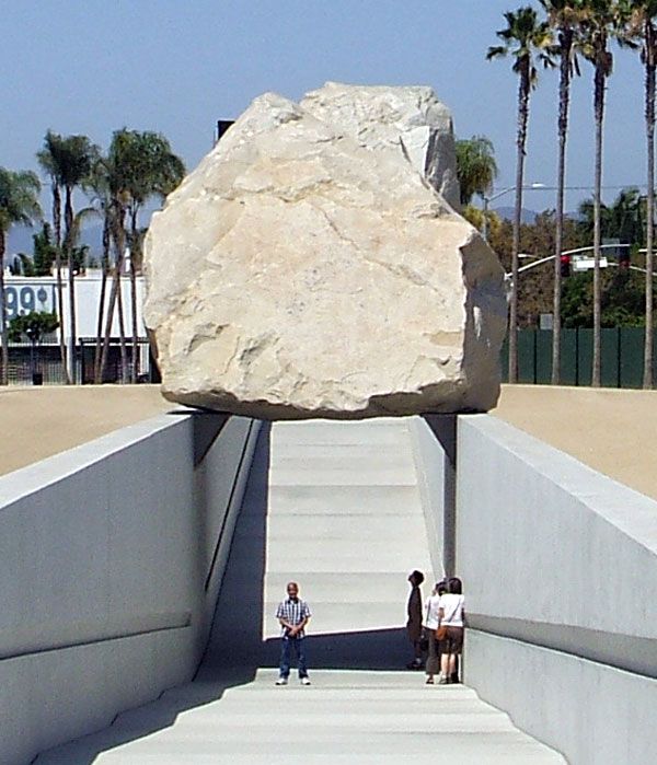 Posing for a photo beneath (err— sort of) 'Levitated Mass' on August 10, 2012.