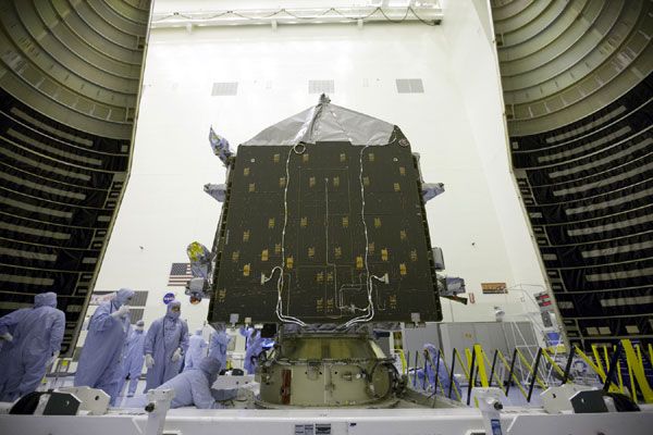 At NASA's Kennedy Space Center in Florida, the MAVEN spacecraft is about to be encapsulated within its Atlas V payload fairing...on November 2, 2013.